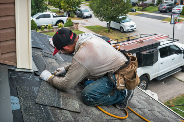 Professional Storm Damage Roof Repair technician working in Somerville, MA